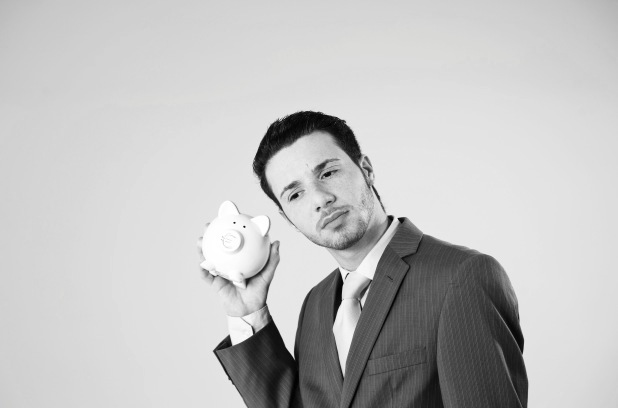 Young man with piggy bank